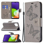 Custodia per telefono in pelle a vibrazione orizzontale con motivo a due farfalle in rilievo con supporto e slot per schede, portafoglio e cordino, For Samsung Galaxy A22 4G