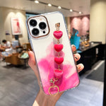 Custodia con motivo marmo dorato e bracciale Love per iPhone