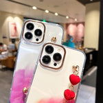 Custodia con motivo marmo dorato e bracciale Love per iPhone