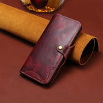 Custodia in vera pelle con bottone magnetico per iPhone 16