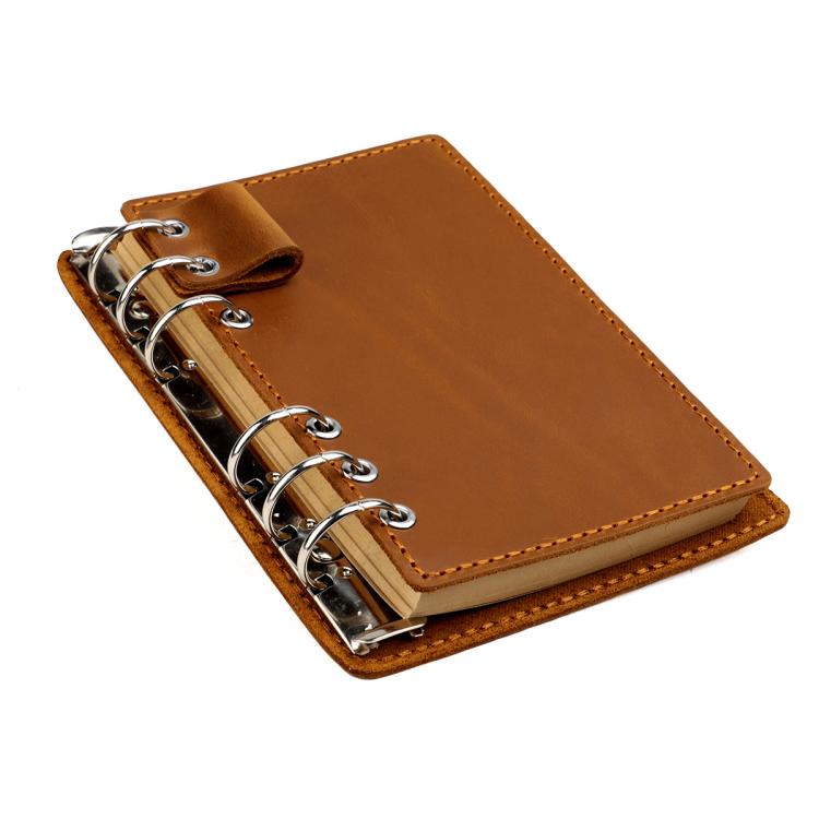 Taccuino vintage in vera pelle con fogli sfusi staccabili, ideale come diario di viaggio.