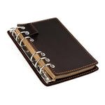 Taccuino vintage in vera pelle con fogli sfusi staccabili, ideale come diario di viaggio.