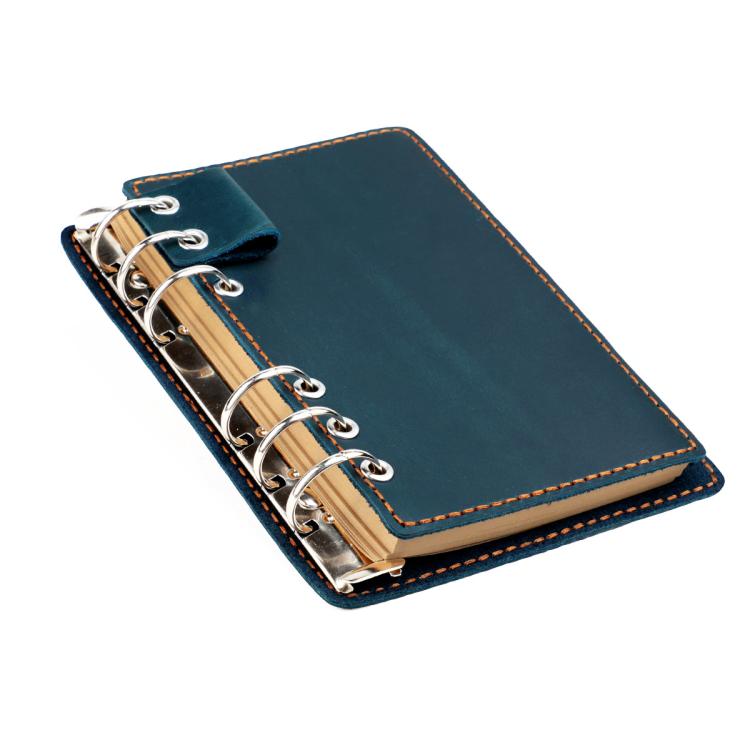 Taccuino vintage in vera pelle con fogli sfusi staccabili, ideale come diario di viaggio.