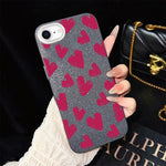 Custodia per telefono ibrida in PC e TPU con motivo a cuori rosso rosa e glitter IMD, For iPhone 15, For iPhone 14 Plus, For iPhone 14, For iPhone 14 Pro, For iPhone 14 Pro Max, For iPhone SE 2022 / SE 2020