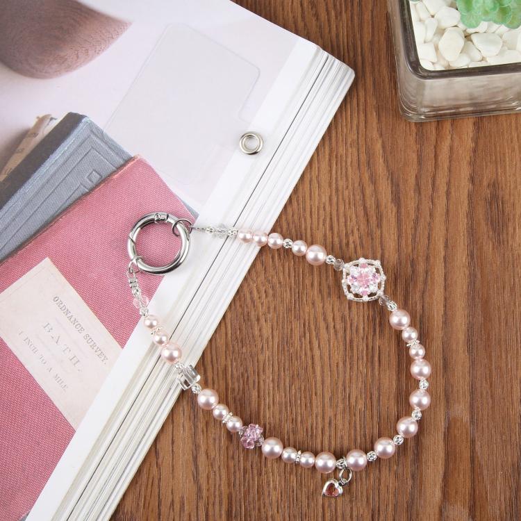 Cinturino da polso per cellulare con perle di zircone e fiore, con laccetto di sicurezza, per donne e ragazze.
