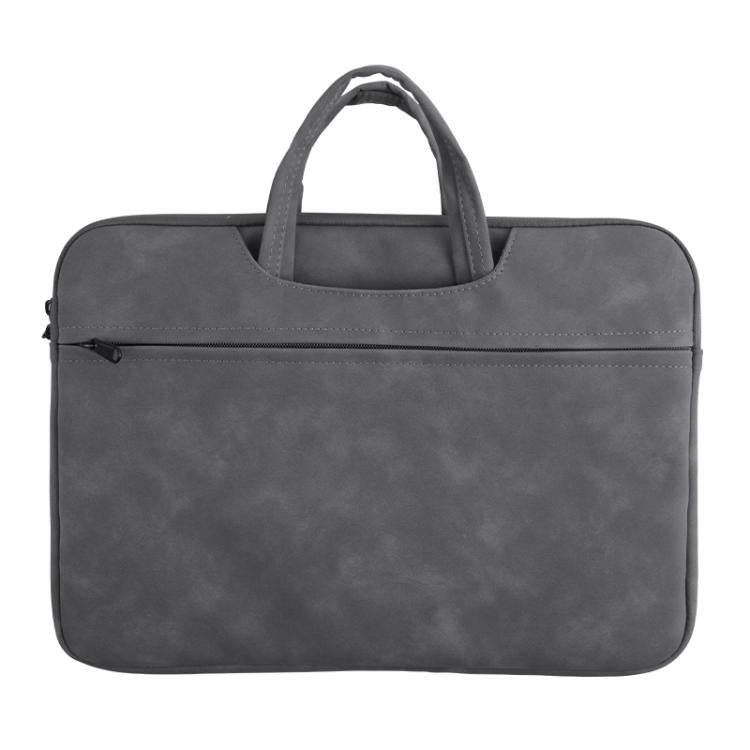 Borsa a mano in pelle di pecora per riporre il laptop.
