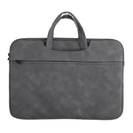 Borsa a mano in pelle di pecora per riporre il laptop.