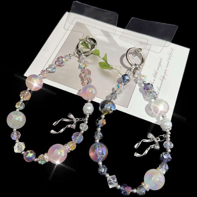 Elegante catena con fiocco in lega, lamina d'oro e perle di cristallo.