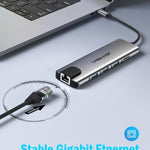 Docking station Lemorele TC39 9 in 1 con HDMI, Ethernet, PD da 100 W e connettore per laptop.