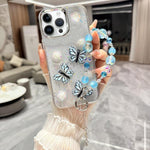 Custodia per telefono in TPU e resina epossidica con farfalla 3D glitterata e bracciale a catena, For iPhone 15 Pro Max, For iPhone 15 Pro, For iPhone 15 Plus, For iPhone 15, For iPhone 14 Plus, For iPhone 14, For iPhone 14 Pro, For iPhone 14 Pro Max
