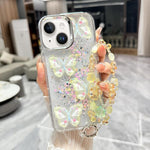 Custodia per telefono in TPU e resina epossidica con farfalla 3D glitterata e catena a bracciale, For iPhone 15 Pro Max, For iPhone 15 Pro, For iPhone 15 Plus, For iPhone 15