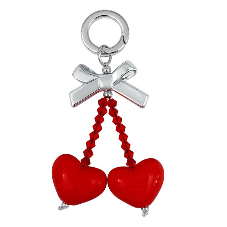Cinghia per cellulare con ornamento a forma di cuore e fiocco di dopamina