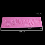 Stampo in silicone per decorazione torta note musicali 20x6 cm
