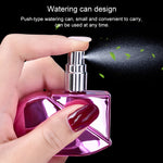 Flacone di profumo spray a forma di cuore