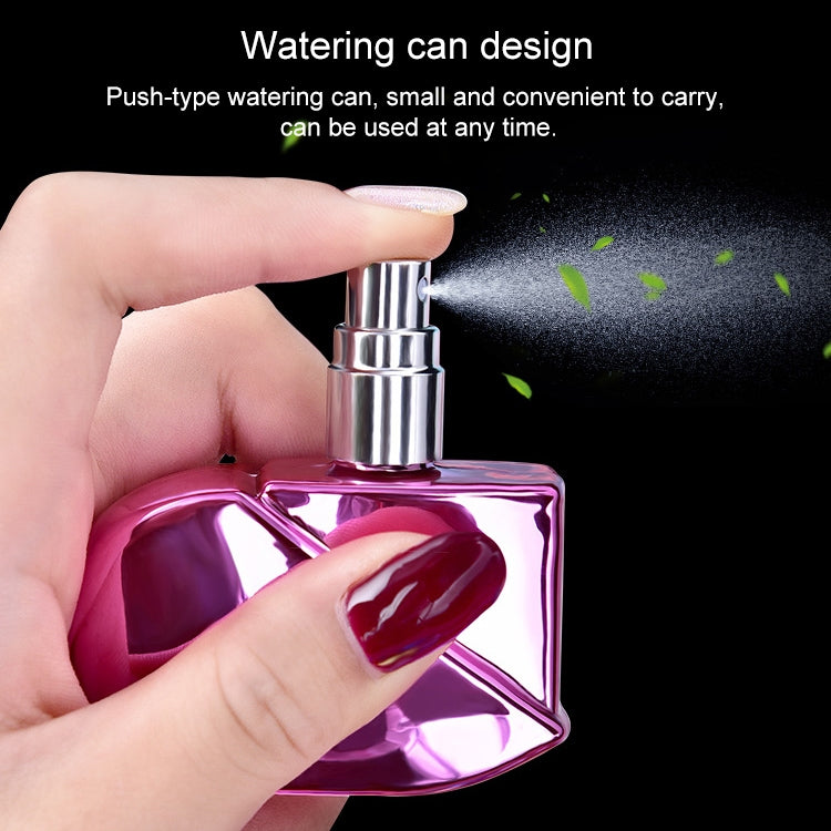 Flacone di profumo spray a forma di cuore