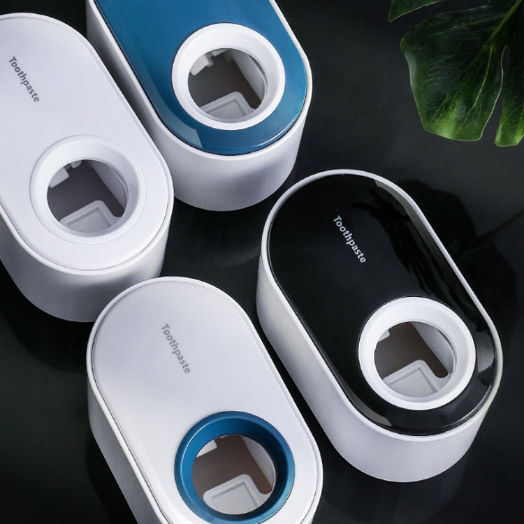 Portadentifricio a parete con spremitura automatica del dentifricio
