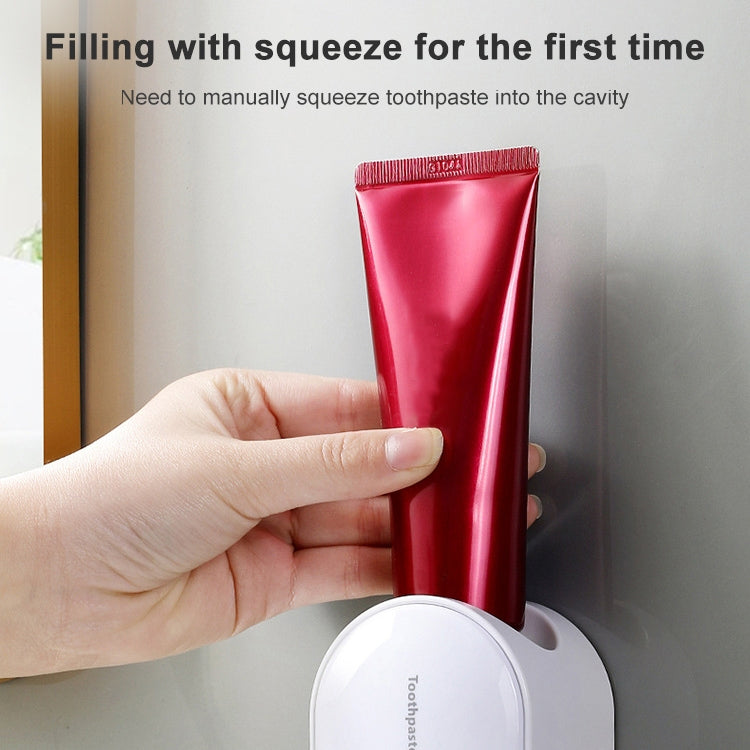Portadentifricio a parete con spremitura automatica del dentifricio