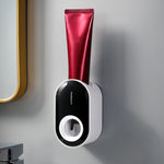 Portadentifricio a parete con spremitura automatica del dentifricio