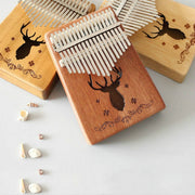 Pianoforte portatile Kalimba a 17 toni, Mahogany-Classic Deer, Bamboo-Classic Deer, Mahogany-Sun God, Mahogany-Six-Pointed Star, Mahogany-Blue (Classic Deer), Spruce-Classic Deer, White-Classic Deer, Acacia-Classic Deer, Sapele-Classic Deer            ...