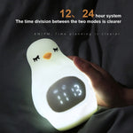 I simpatici fagioli in silicone multifunzionali creativi del pinguino svegliano i bambini che dormono Sveglia elettronica a LED