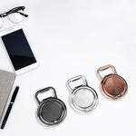 Apribottiglie pieghevole in metallo con supporto smartphone