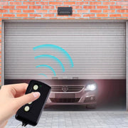 Telecomando per porta da garage a codice fisso con modulazione di frequenza 250-450 MHz.