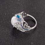 Anello donna in argento con opale naturale e motivo piuma