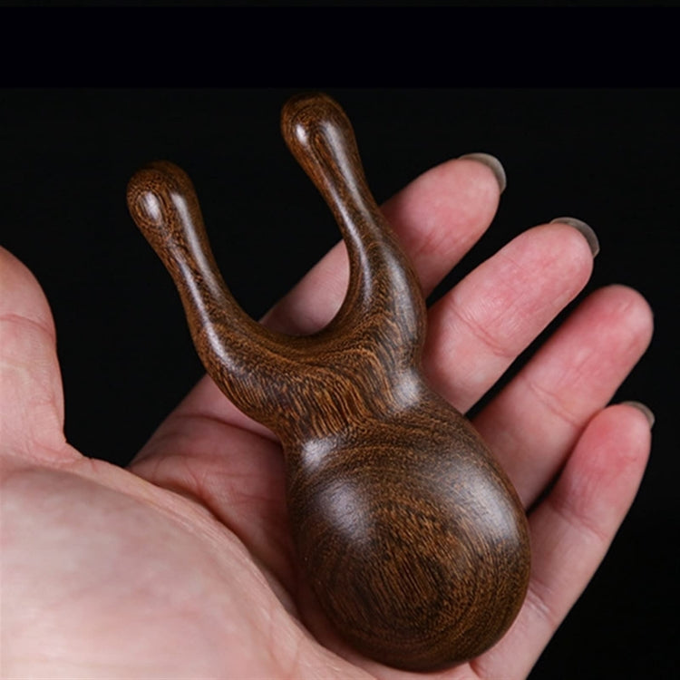 Massaggiatore viso in legno di sandalo dorato 11cm