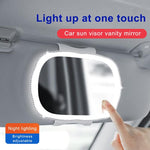 Specchietto per il trucco con luce LED integrata nell'aletta parasole del passeggero dell'auto.