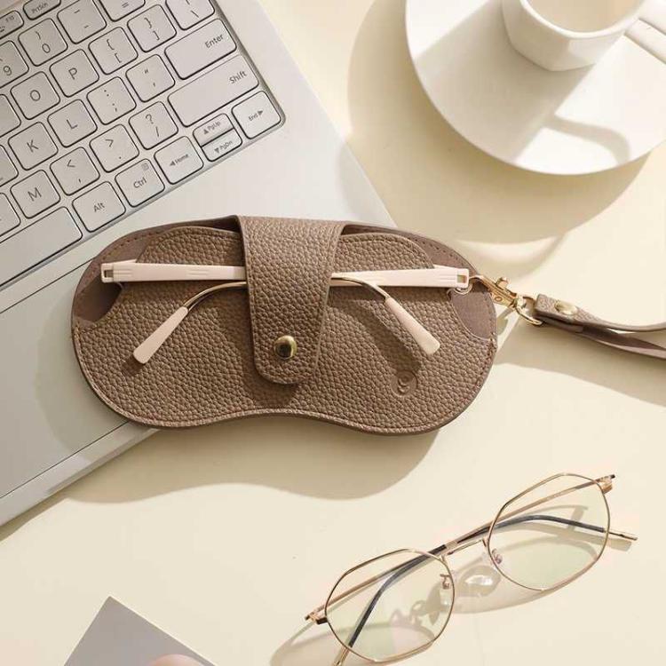 Custodia per occhiali da appendere in pelle PU, astuccio portatile da viaggio per occhiali da vista e da sole.