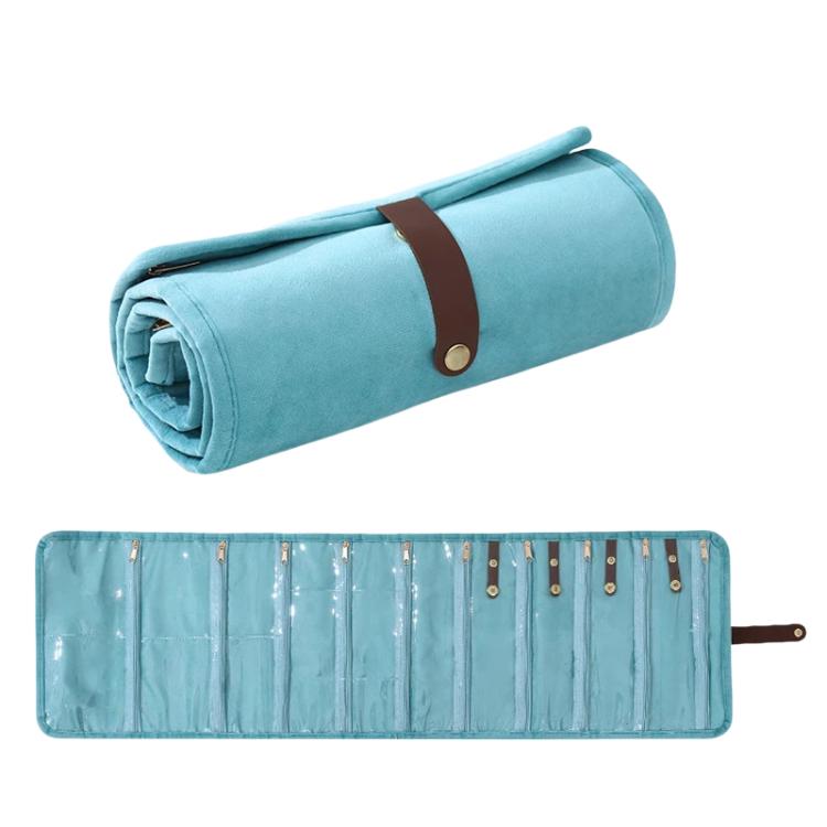 Borsa organizer arrotolabile in velluto per gioielli, con scomparti multipli per collane, bracciali e accessori in oro.