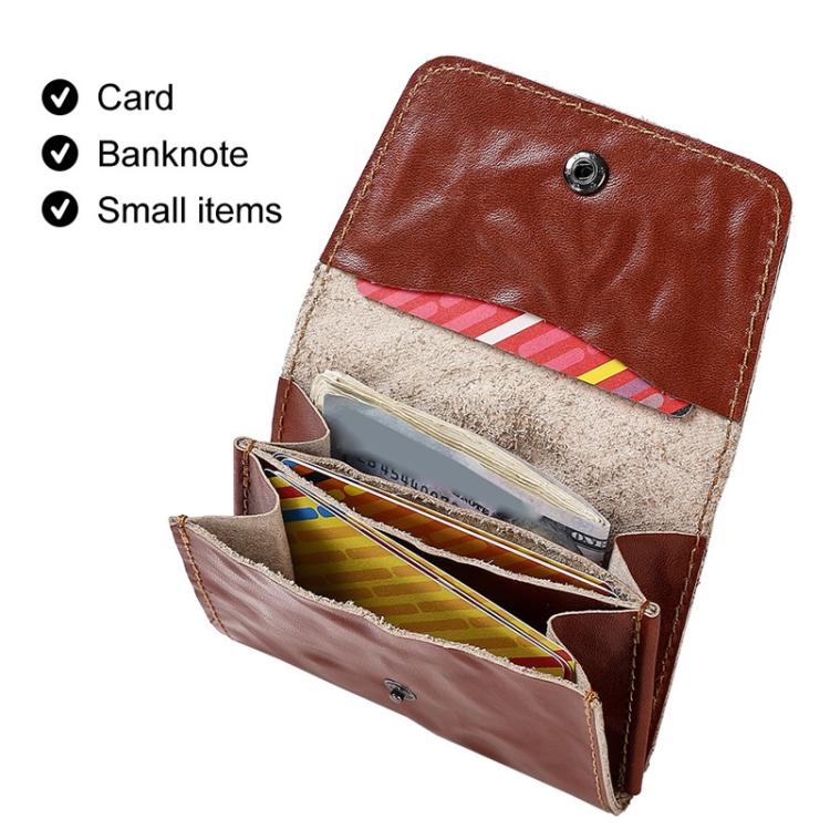Portafoglio porta carte di credito e portamonete HUMERPAUL HU115 in pelle conciata al vegetale con decorazioni a rilievo.