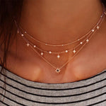 Collana con ciondolo a stella multistrato
