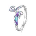 Anello regolabile con apertura a forma di cavalluccio marino, placcato rame e oro bianco.