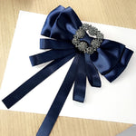 Spilla da donna con fiocco in tessuto satinato vintage con fiocco e strass quadrati